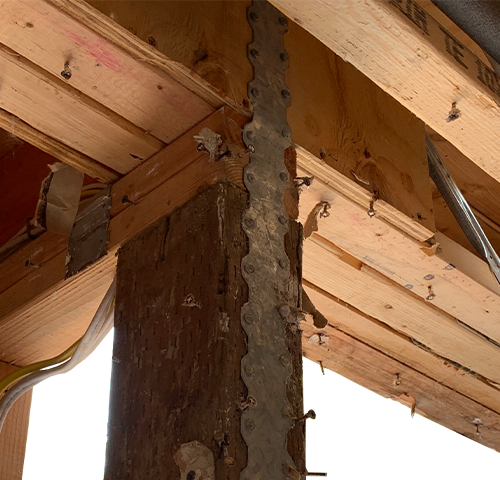 Close up of wood beams with metal in them