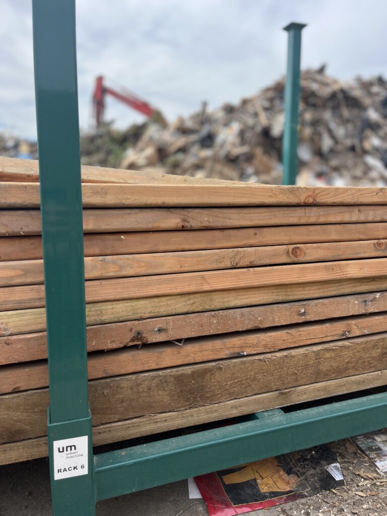reclaimed lumber being gathered at landfill for reuse in construction